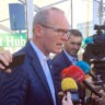 Minister Coveney addresses reporters in Carlow